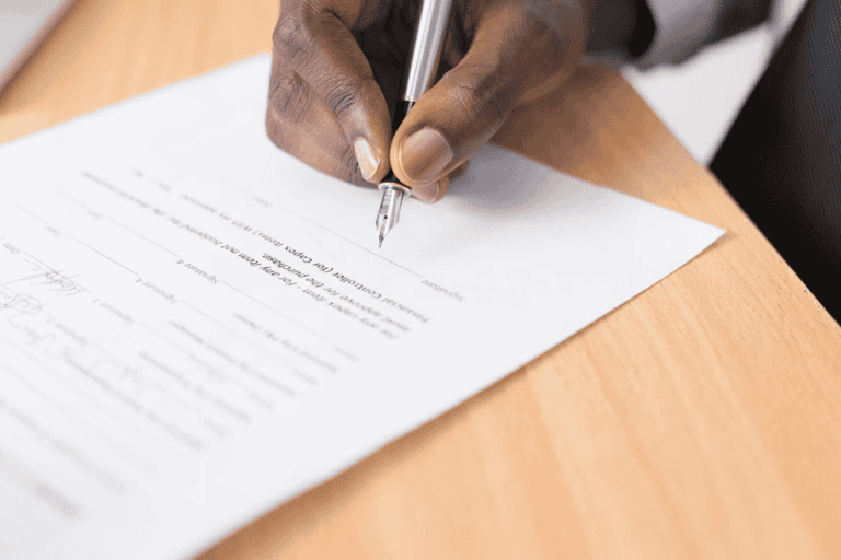 Alberta landlord preparing a written eviction notice in compliance with the Residential Tenancies Act