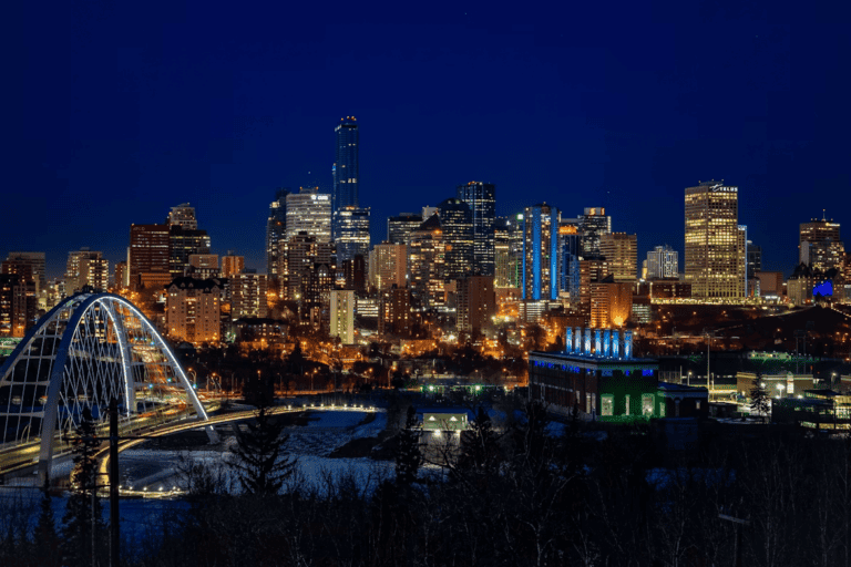 Side-by-side comparison of Edmonton and Winnipeg skylines representing cost of living and lifestyle differences
