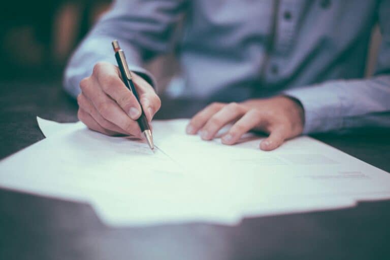 Edmonton real estate lawyer reviewing closing documents and land title transfer for a home purchase