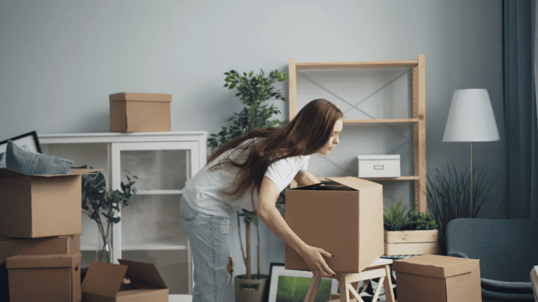 New resident completing paperwork from a moving to Alberta checklist after relocating to Edmonton