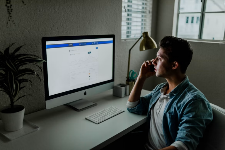 New Edmonton realtor building a real estate lead generation plan at a laptop