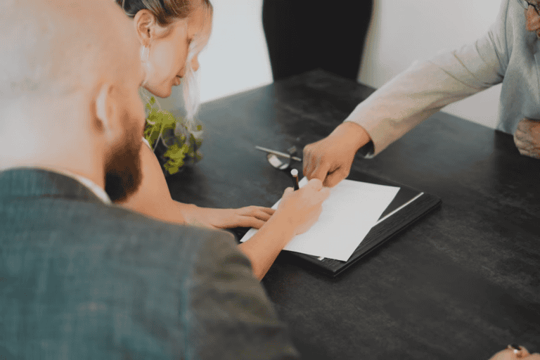 Edmonton home seller reviewing legal paperwork to avoid common selling mistakes