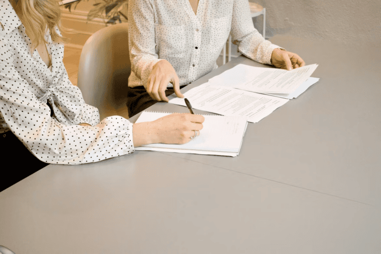 Edmonton homeowner reviewing an active insurance claim file while preparing to sell a home