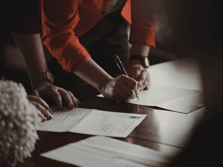 Alberta seller reviewing disclosure paperwork about past water damage before selling a home