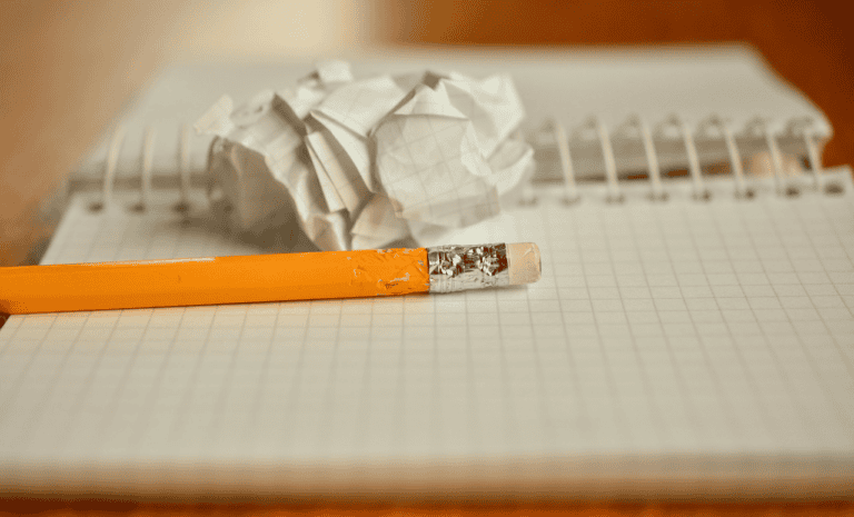 Frustrated homeowner reviewing paperwork while selling a house in Edmonton in a balanced market
