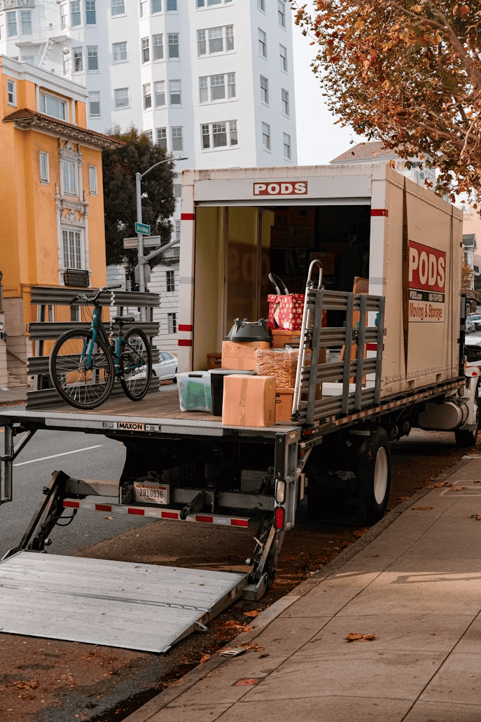 Packed moving truck outside an Edmonton home, representing relocating out of Edmonton