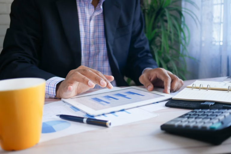 New real estate investor reviewing numbers, avoiding common real estate investing mistakes