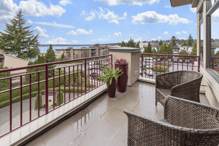 Bright modern condo interior with a balcony view, illustrating downsizing to a condo in Edmonton