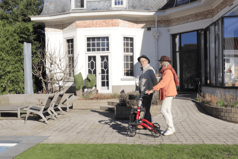 Older couple sorting belongings in a bright living room while downsizing their home in Edmonton
