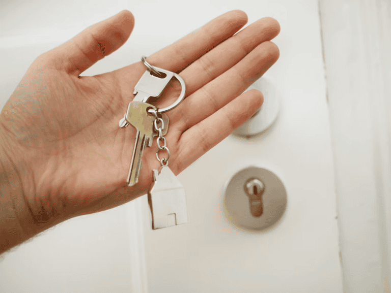 Buyers receiving keys on possession day, showing what happens after offer accepted in Edmonton