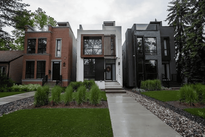 Two new narrow infill houses side by side on a split lot, an example of a skinny home in Edmonton