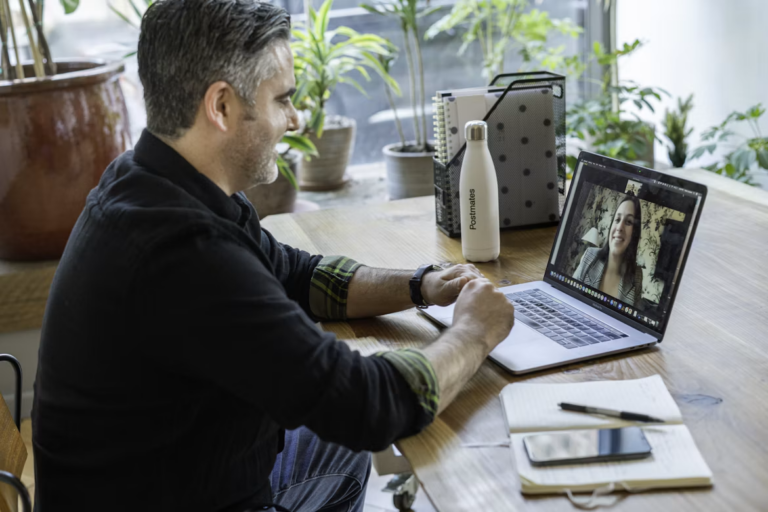 Edmonton realtor on a video call with an out-of-province family, working as a relocation specialist realtor