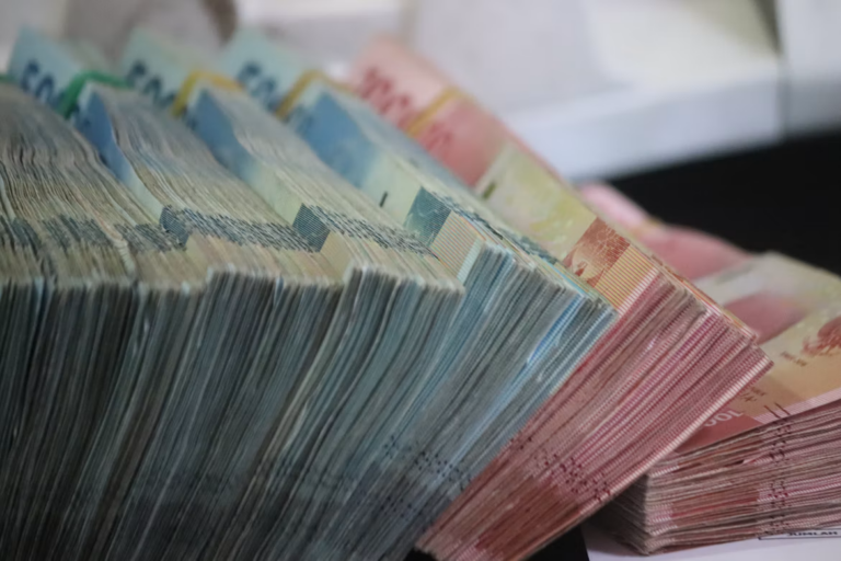 Real estate investor reviewing short-term financing terms for an Edmonton renovation project