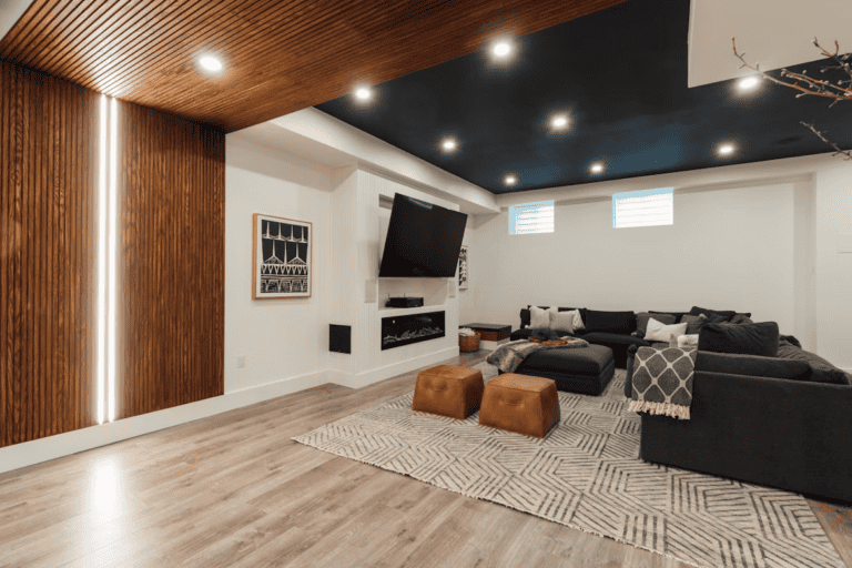 Bright finished basement with egress window in an Edmonton home, showing finished basement home value